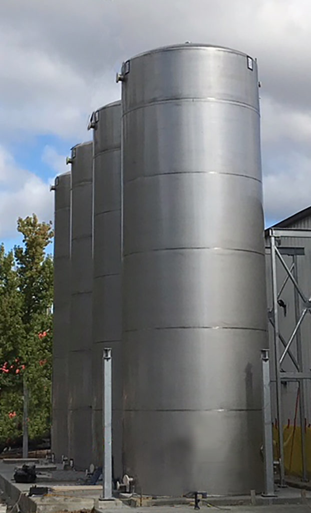 Vertical Stainless Steel Silos in a Row